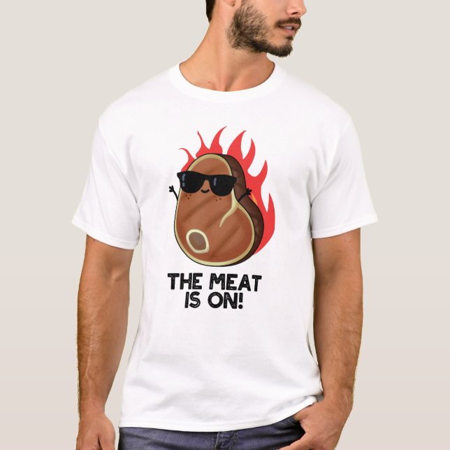 The Meat Is On Funny Food Steak Pun  T-Shirt (Front)