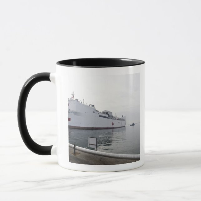 The Military Sealift Command hospital ship Mug (Left)