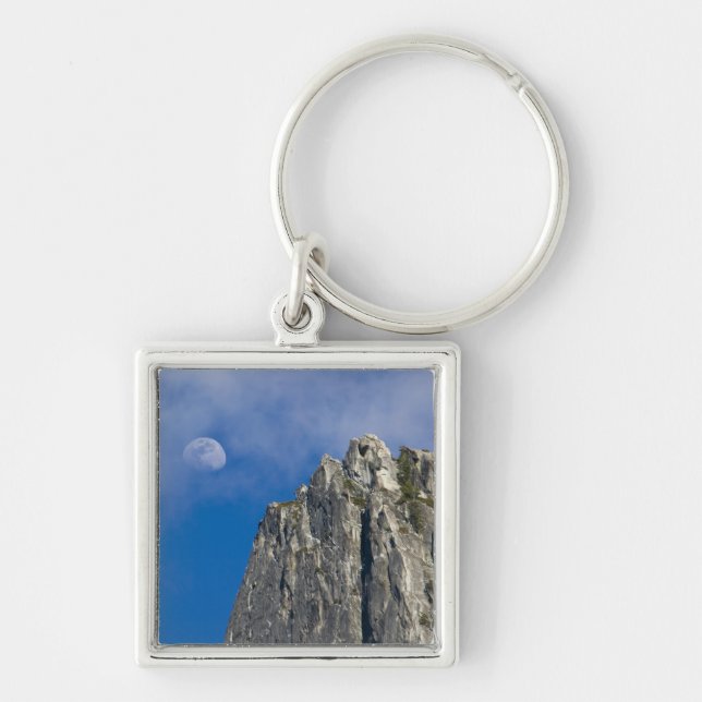 The moon rises and shines through the clouds key ring (Front)