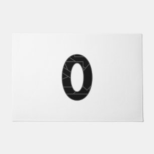 The number zero (0) in black doormat