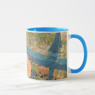 The orange rose behind the blue fence mug
