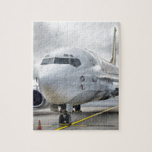 The plane at the airport on road jigsaw puzzle