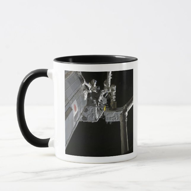 The robotic arm of the Japanese Experiment Modu Mug (Left)