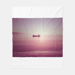 The silhouette of fisherman with boat in the sea v fleece blanket