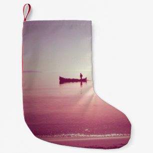 The silhouette of fisherman with boat in the sea v small christmas stocking