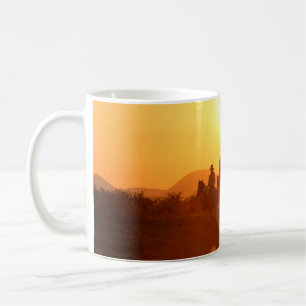The silhouette of rider as cowboy outfit costume w coffee mug