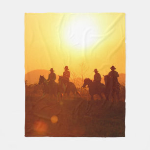 The silhouette of rider as cowboy outfit costume w fleece blanket