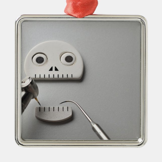 The skeleton which dental treatment is taken metal tree decoration (Front)