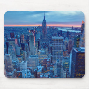 The skyscrapers of Manhattan are lit Mouse Pad