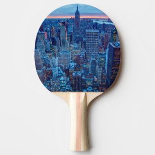 The skyscrapers of Manhattan are lit Ping Pong Paddle