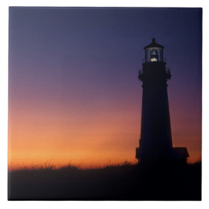 The sun ball drops down on the colourful horizon ceramic tile