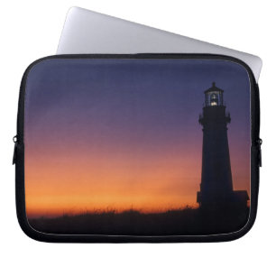 The sun ball drops down on the colourful horizon laptop sleeve
