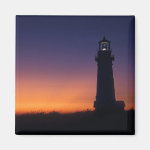 The sun ball drops down on the colourful horizon magnet