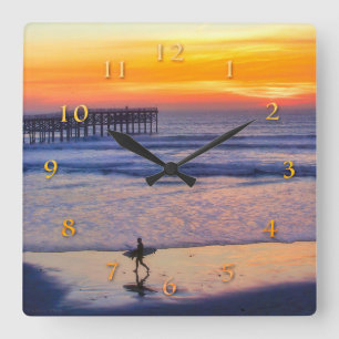 THE SUN HEADING HOME SURFER SQUARE WALL CLOCK