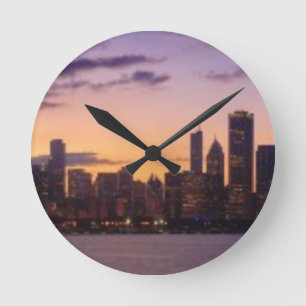 The sun sets over the Chicago skyline Round Clock