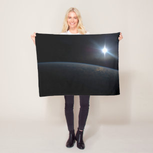 The Sun Setting Over Earth's Horizon. Fleece Blanket