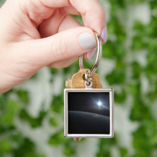 The Sun Setting Over Earth's Horizon. Key Ring