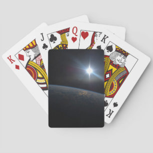 The Sun Setting Over Earth's Horizon. Playing Cards