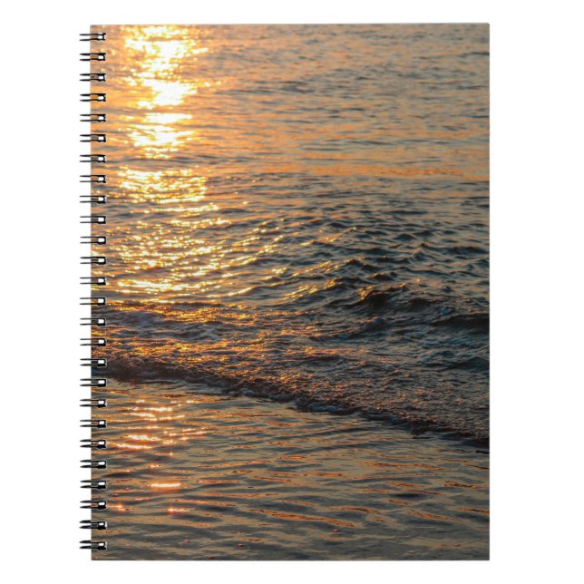 The sunset reflection on the beautiful ocean water notebook (Front)