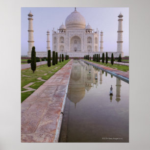 The Taj Mahal perfectly reflected in the still Poster