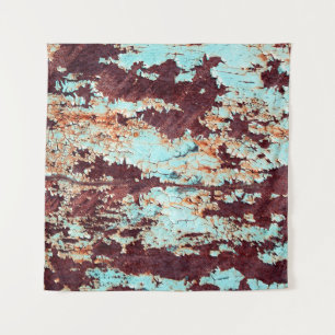 The texture of a rusty iron and a blue strongly pe tapestry