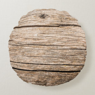 The texture of an old wooden log without bark with round cushion