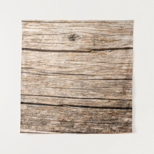 The texture of an old wooden log without bark with tapestry