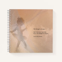 The tiny ballerina graces a notebook.