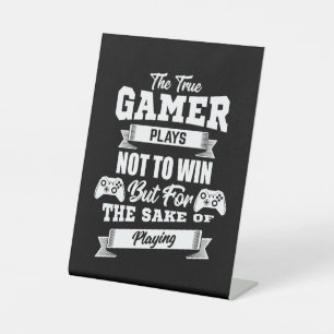 The True Gamer Plays Not To Win Pedestal Sign