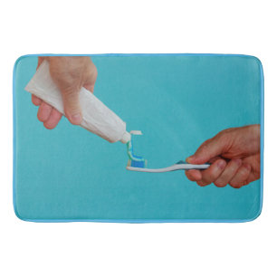 the tube of toothpaste on custom large bath mat