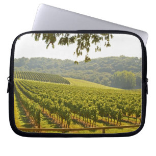 The vineyard and a valley with a forest - laptop sleeve