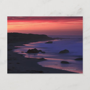 The warm hues of dawn reflect along the postcard
