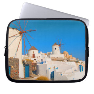 The white buildings and the windmills on the laptop sleeve