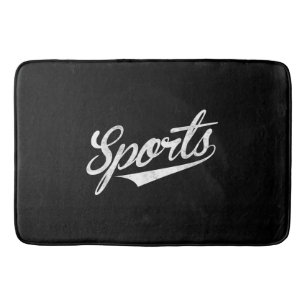 The word Sports A funny ironic design that says S Bath Mat