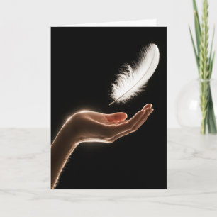 Thinking of You Hand Releasing a White Feather Card