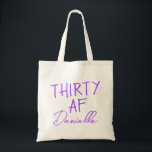 THIRTY AF Personalised Funny 30th Birthday Tote Bag<br><div class="desc">This personalised “THIRTY AF” tote bag is the ultimate 30th birthday accessory — bold, fun, and fabulously functional. Featuring a custom name in elegant vibrant purple script beneath the playful slogan, it’s perfect for brunches, gifting, errands, or that post-party coffee run. Made for birthdays with attitude, this bag is as...</div>