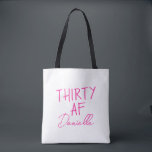 THIRTY AF Personalised Funny 30th Birthday Tote Bag<br><div class="desc">Celebrate turning 30 in bold style with this personalised “THIRTY AF” tote bag. Featuring vibrant pink text and your custom name in elegant script, this playful yet practical bag is perfect for birthday brunches, party essentials, or gift-giving flair. Whether you’re treating yourself or surprising your bestie, this tote adds sass...</div>