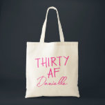 THIRTY AF Personalised Funny 30th Birthday Tote Bag<br><div class="desc">This personalised “THIRTY AF” tote bag is the ultimate 30th birthday accessory — bold, fun, and fabulously functional. Featuring a custom name in elegant vibrant pink script beneath the playful slogan, it’s perfect for brunches, gifting, errands, or that post-party coffee run. Made for birthdays with attitude, this bag is as...</div>