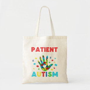 This shirt feature autism puzzle pieces makes the tote bag