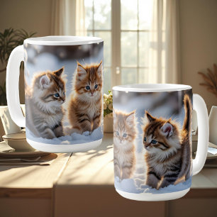 Three adorable kittens playing in the snow, cute coffee mug