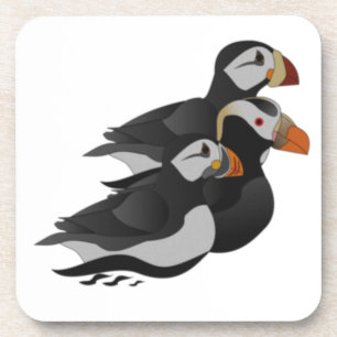 Three Adorably Friendly Puffins Swimming Cartoon Coaster