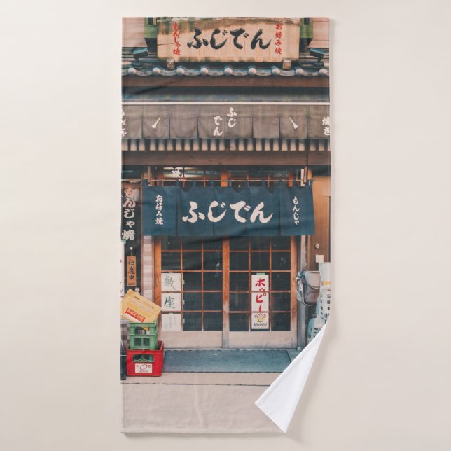 THREE BICYCLES PARKED IN FRONT OF BUILDING BATH TOWEL (Bath Towel)