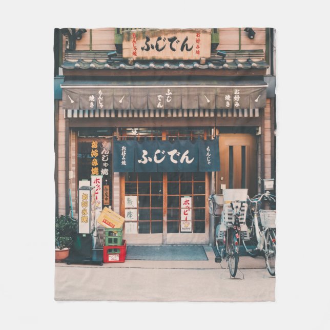 THREE BICYCLES PARKED IN FRONT OF BUILDING FLEECE BLANKET (Front)