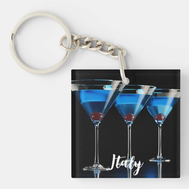 Three blue cocktails with cherry on black key ring (Front)