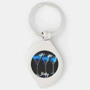 Three blue cocktails with cherry on black key ring