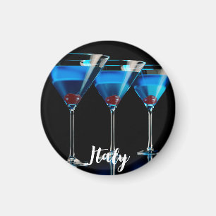 Three blue cocktails with cherry on black magnet