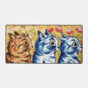 Three cats singing by Louis Wain Desk Mat