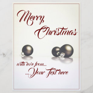 Three christmas balls in front of light background