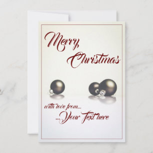 Three christmas balls in front of light background