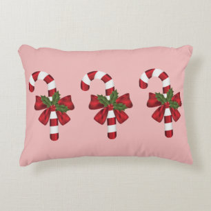 Three Christmas Candy Canes On Light Pink Decorative Cushion